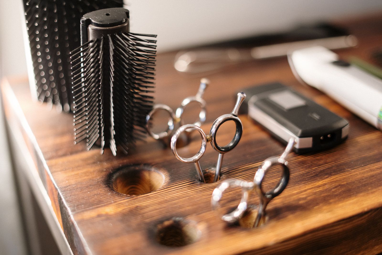Hair styling tools arranged on a salon table