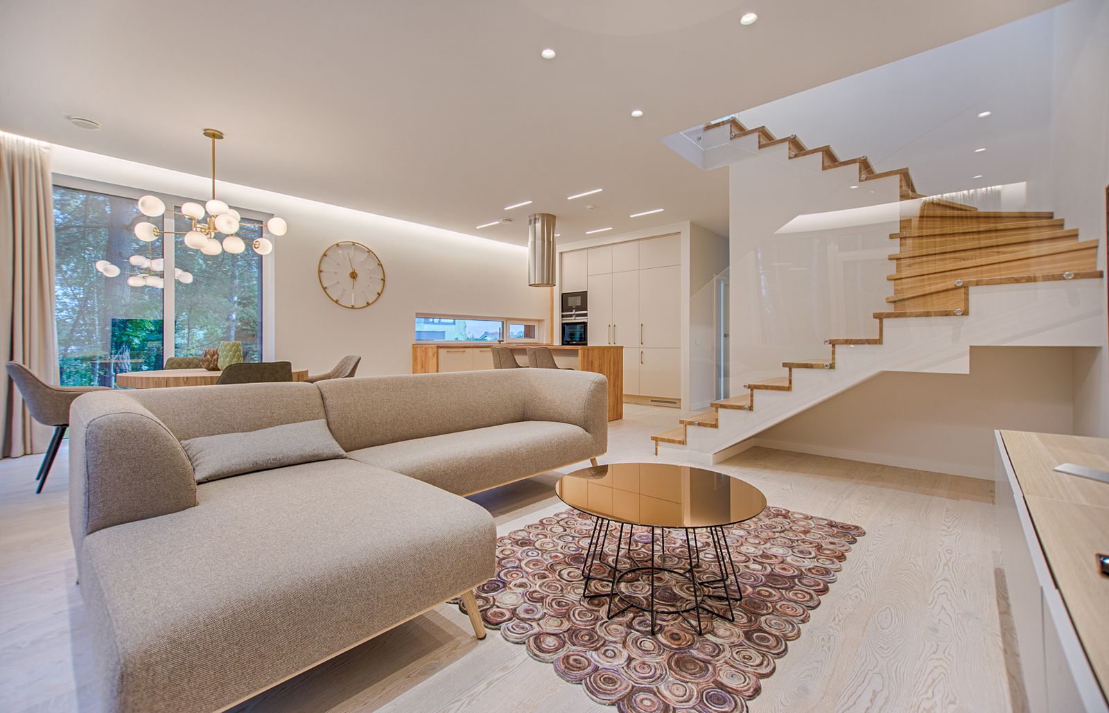 A furnished living room with an open wooden floor