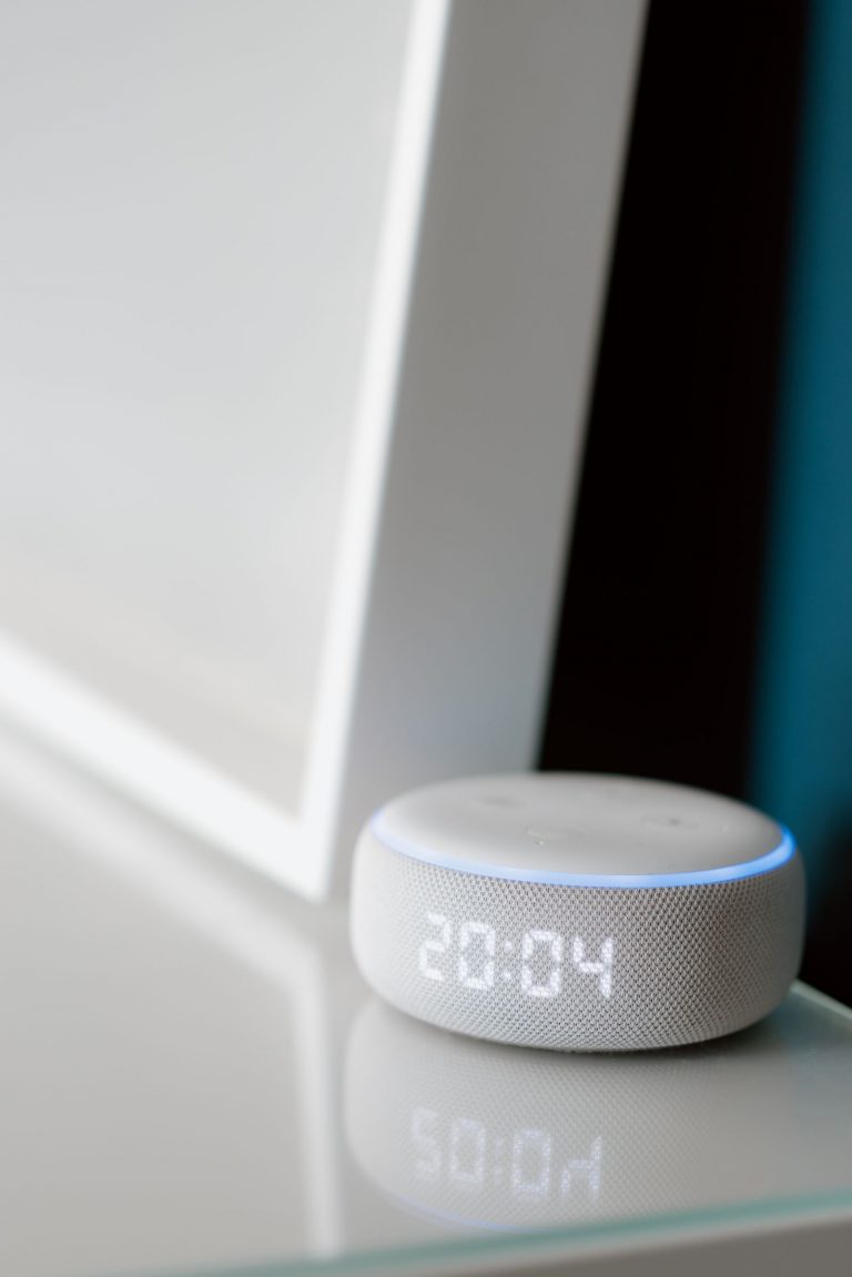 Smart speaker placed on a table in a modern living room
