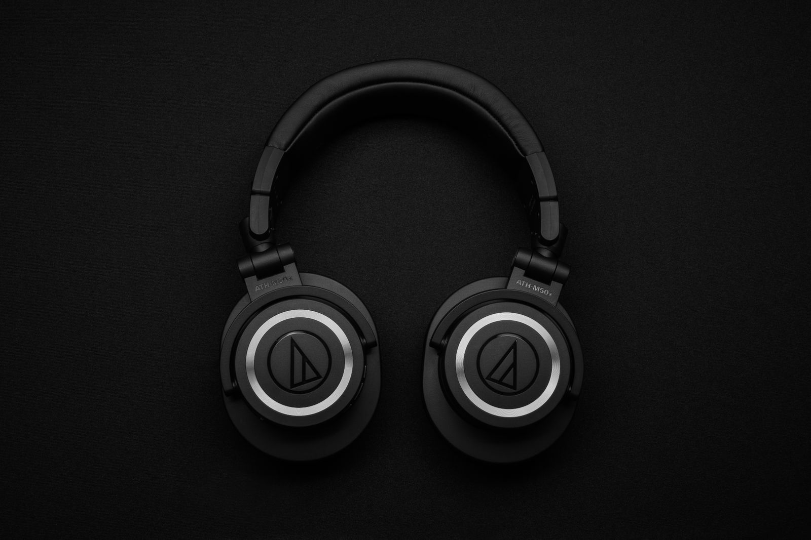 Headphones beside a smartphone on a table