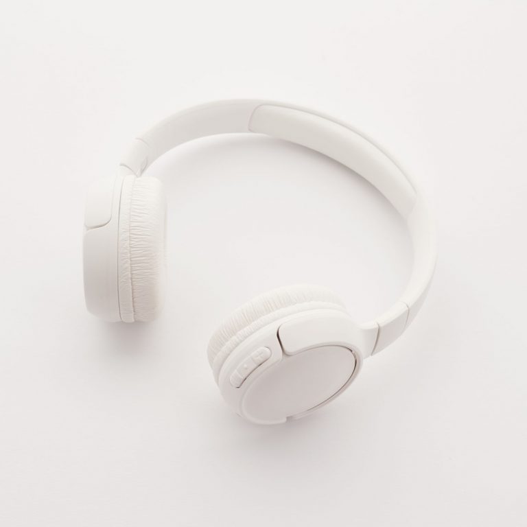 A person listening to music through over-ear headphones