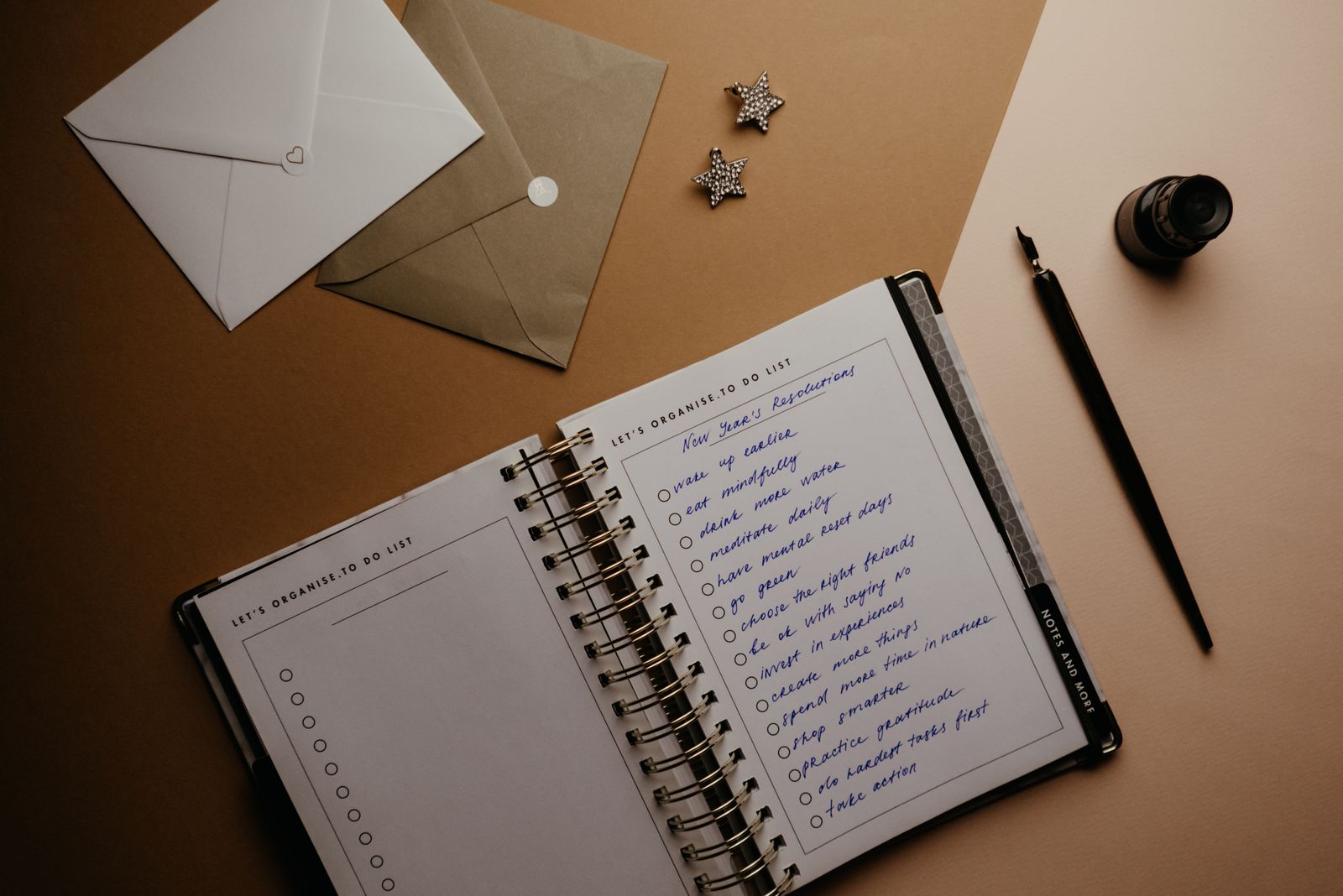 A person marking a checklist in a notebook